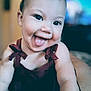 Milahni joined the competition — help win amazing prizes! baby, child, tongue_out, smiling, cute, portrait, indoors, maroon_dress, cheeky, close_up, happy, face, skin, person, infant, young_child, playful, expression, human, head