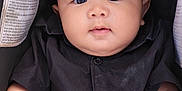 Harkin Hezekiah is registered to the contest to win money with this photo: baby, black_shirt, car_seat, child, chubby_cheeks, clothing, cute, expression, eyes, face, hands, head, indoors, infant, person, portrait, sitting, skin, warning_label, young_child