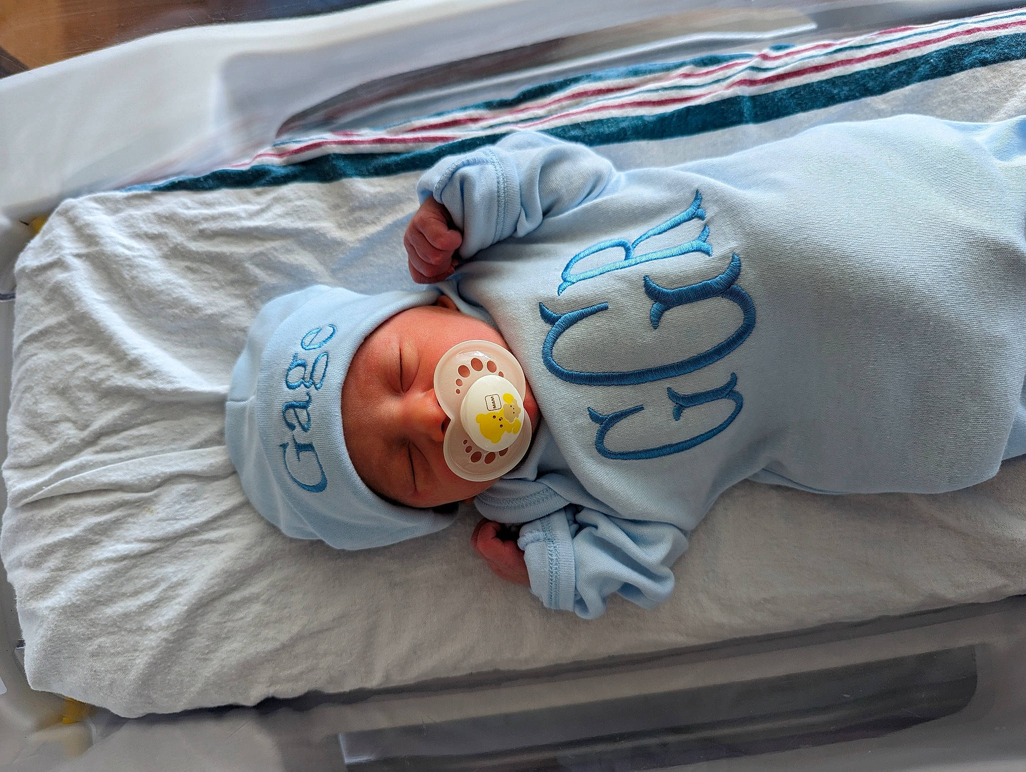 Gage is registered to the contest to win money with this photo: baby, baby_products, baby_safety, baby_sleeping, baby_toddler_clothing, bedding, bedtime, child, comfort, headwear, illustration, linens, nap, person, product, room, sleep, sleeve, textile, toddler