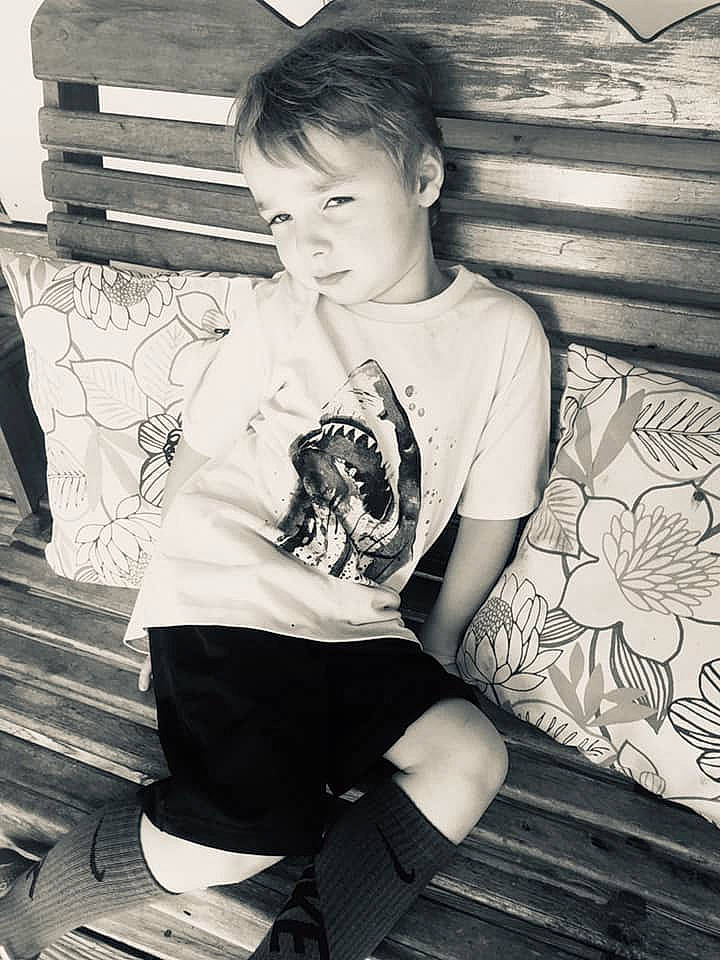 Benjamin is registered to the contest to win money with this photo: arm, black_and_white, child, cool, eye, joint, leg, monochrome, monochrome_photography, person, photograph, photography, sitting, smile, snapshot, standing, style, t_shirt, toddler, trunk