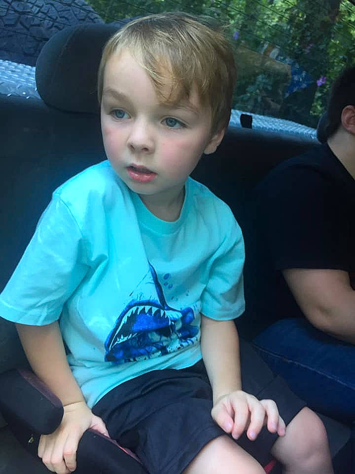 Benjamin is registered to the contest to win money with this photo: child, cool, fun, leg, person, sitting, smile, summer, t_shirt, toddler, vacation