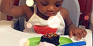 Essence is registered to the contest to win money with this photo: toddler, child, high_chair, cake, ice_cream, party_hat, birthday, food, plate, spoon, hand_raised, tank_top, watermelon_print, sprinkles, indoor, table, celebration, cute, happy, person
