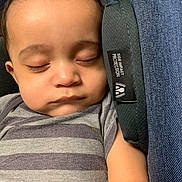 Rowen is registered to the contest to win money with this photo: baby, sleeping, car_seat, striped_clothing, infant, child, peaceful, face, closed_eyes, onesie, soft_light, protection_tag, portrait, young_child, resting, cute, head, arm, closeup, indoors