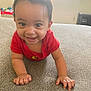 Rowen is registered to the contest to win money with this photo: baby, child, crawling, smiling, red_shirt, indoor, couch, happy, cute, face, hands, infant, person, home, furniture, playful, young, portrait, bright, curious