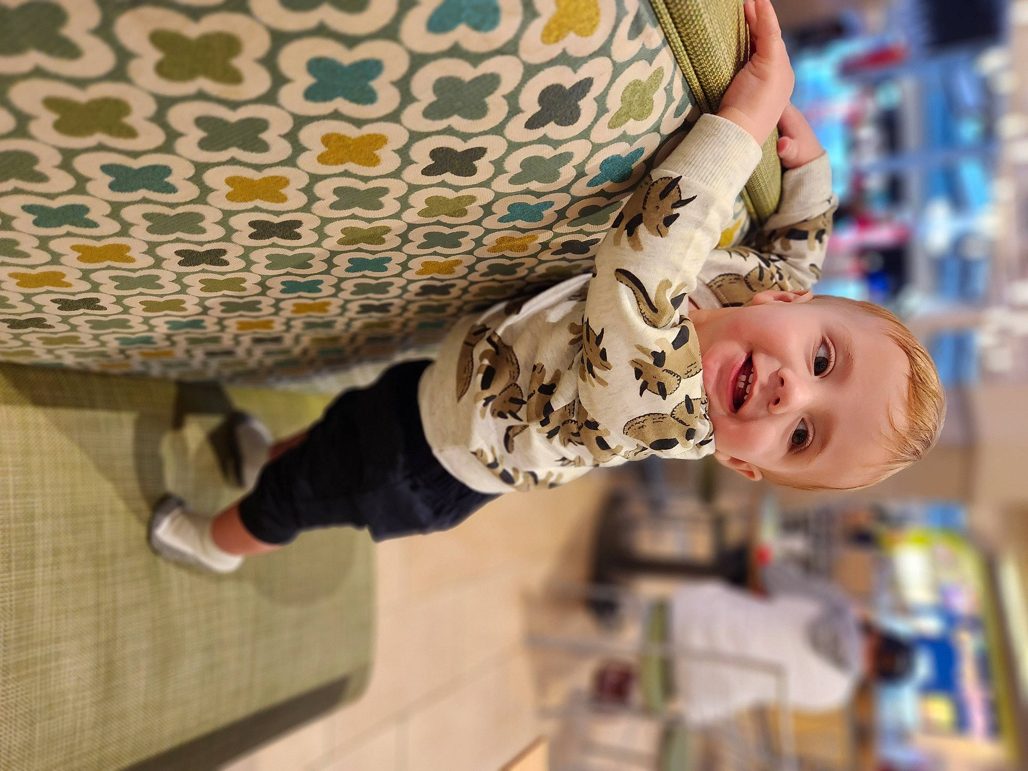 Elijah joined the competition — help win amazing prizes! abdomen, baby, child, comfort, flooring, fun, happy, human_leg, joy, leisure, linens, pattern, person, room, sitting, smile, thigh, toddler, waist, wood