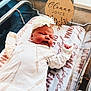 Olenna joined the competition — help win amazing prizes! newborn, baby, hospital_bassinet, sleeping, white_outfit, headband, flower, blanket, name_plaque, indoor, person, infant, resting, cute, soft_lighting, hospital, newborn_baby, child, portrait, peaceful