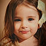 Fybie participe au concours pour gagner de l'argent avec cette photo : child, girl, portrait, smile, bow, hair, eyes, face, close_up, studio_lighting, cute, innocent, dress, shoulders, skin, soft_focus, headshot, warm_tones, bokeh, expression