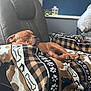 Oliver is registered to the contest to win money with this photo: puppy, dog, sleeping, blanket, chair, indoor, cozy, brown, pet, resting, cute, relaxed, furniture, fabric, pattern, paw, domestic_animal, animal, comfort, home