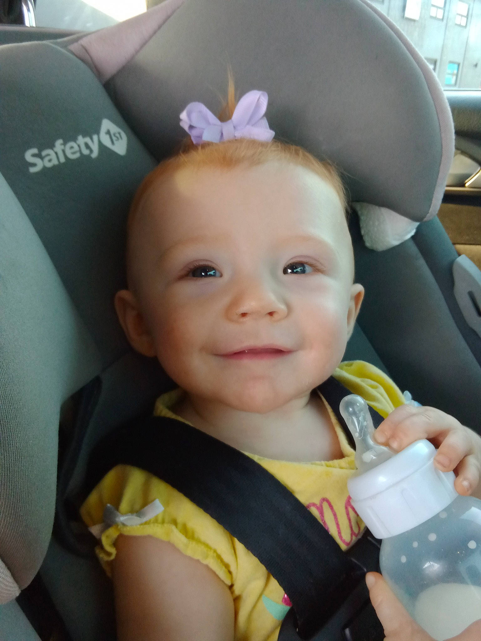 Izabel is registered to the contest to win money with this photo: baby, baby_products, baby_toddler_clothing, blue, car_seat, cheek, child, ear, eye, finger, fun, happy, neck, nose, person, plastic_bottle, product, skin, smile, toddler