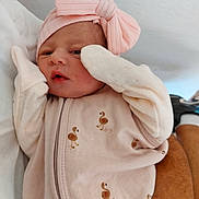 Cassie participe au concours pour gagner de l'argent avec cette photo : baby, newborn, pink, bow, mittens, flamingo_pattern, sleepwear, infant, cute, soft, hand, resting, portrait, clothing, headband, person, skin, face, lying_down, cozy