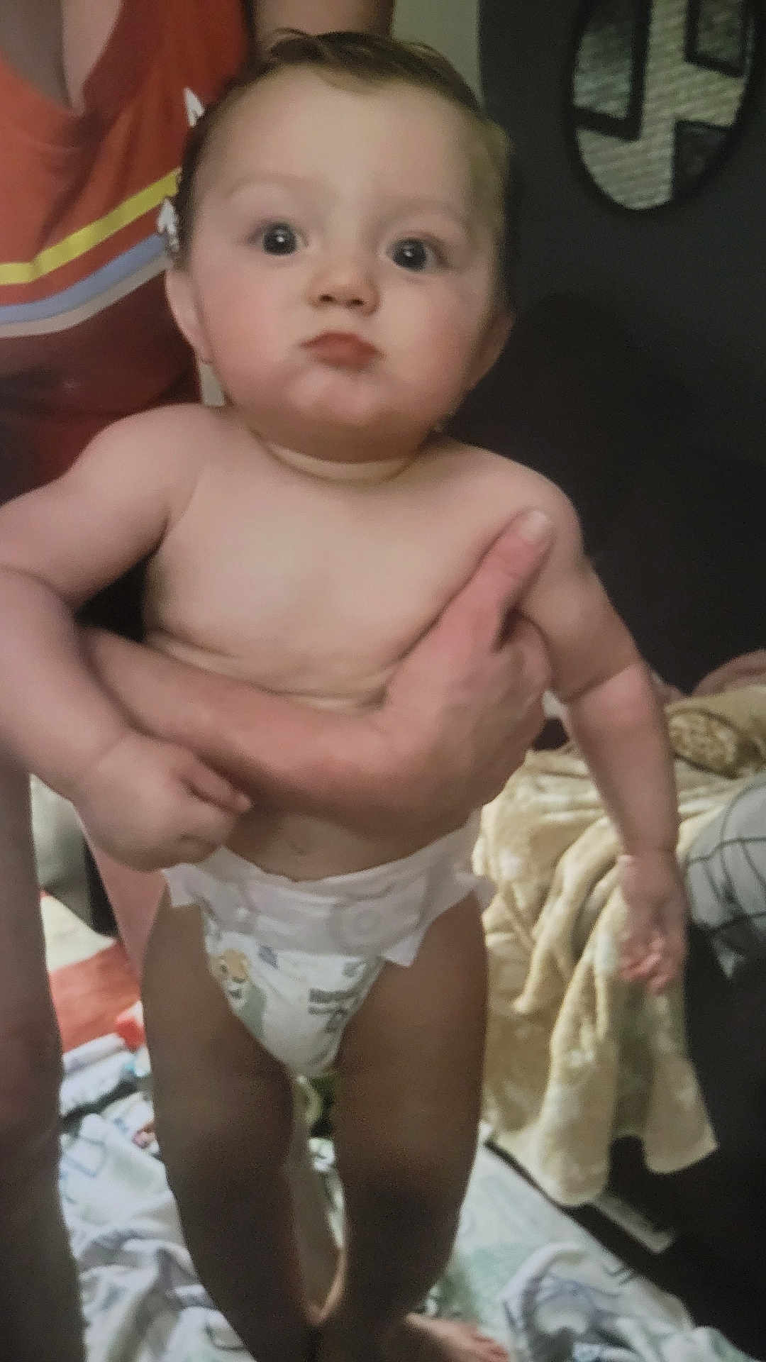 Lucas joined the competition — help win amazing prizes! baby, diaper, child, indoor, pout, person, arm, hand, blanket, furniture, floor, skin, expression, holding, closeup, infant, cute, human, room, casual
