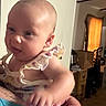 Laelyn Faith is registered to the contest to win money with this photo: adult_hand, baby, cabinet, child, clothing, curtain, cute, expression, face, furniture, hand, holding, home, indoor, infant, light, pacifier, person, room, skin