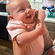 Laelyn Faith is registered to the contest to win money with this photo: baby, infant, smile, happy, person, kitchen, window, cabinet, onesie, arm, hand, indoor, home, human, face, skin, holding, expression, child, cute