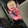 toddler, child, car_seat, raincoat, smiling, happy, dog, black_dog, car_interior, seatbelt, jacket, transparent_clothing, vehicle, pet, canine, young_child, baby, portrait, indoor, cute