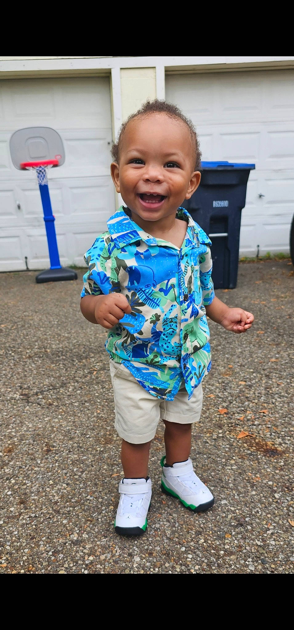 Torian is registered to the contest to win money with this photo: baby, baby_toddler_clothing, child, electric_blue, face, fun, grass, happy, head, human_leg, joy, leisure, pattern, person, play, recreation, sleeve, smile, t_shirt, tire