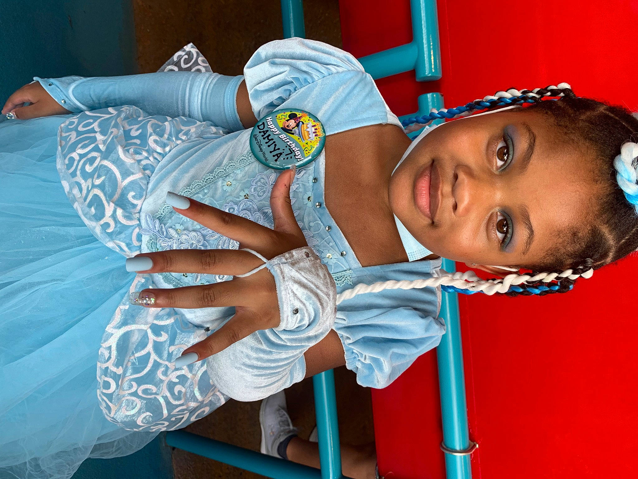 Damiyah is registered to the contest to win money with this photo: arm, black_hair, blue, child, comfort, elbow, electric_blue, fun, happy, human_body, joy, leisure, mouth, organ, person, room, sitting, skin, textile, thigh