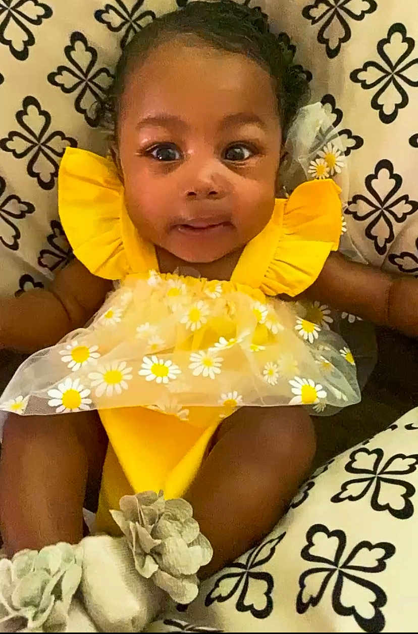 Divinity joined the competition — help win amazing prizes! baby, babylaughing, clothing, cushion, dress, face, flower, hair, happy, hat, head, homedecor, person, photography, plant, portrait, rose, sitting, sleeve, smile