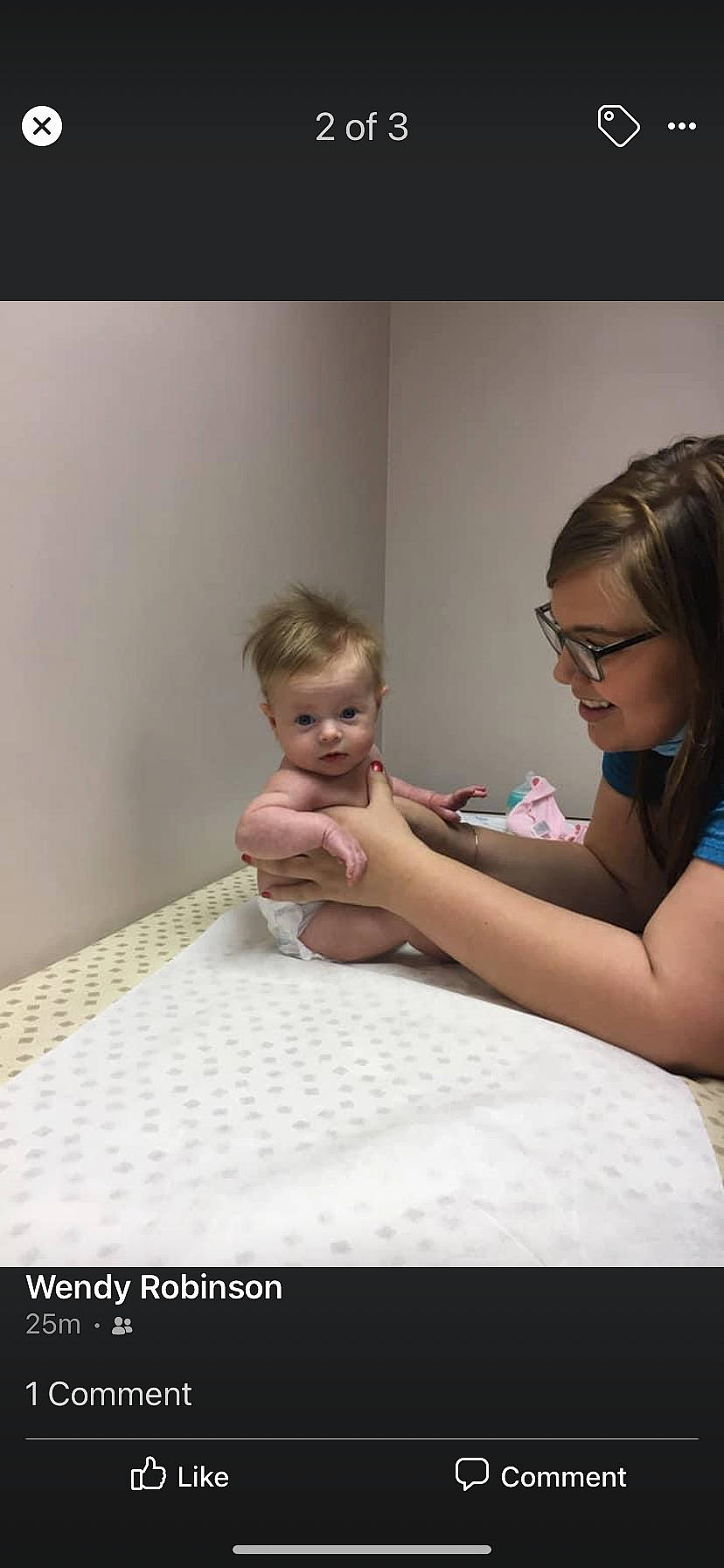 Ella Jane is registered to the contest to win money with this photo: baby, child, comfort, elbow, event, eyelash, flash_photography, flooring, fun, gesture, glasses, hair, happy, linens, person, room, shoulder, sitting, smile, toddler