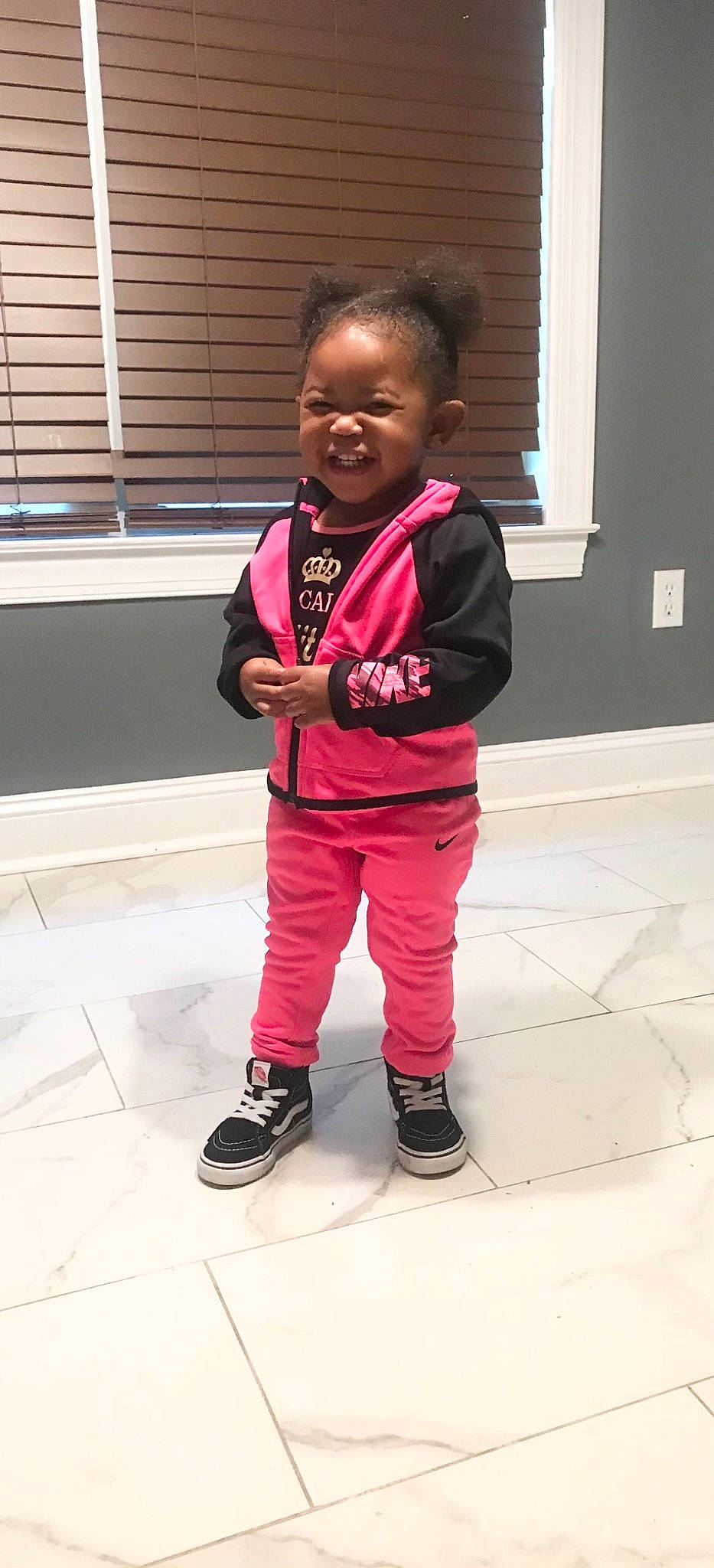 Ahzaria is registered to the contest to win money with this photo: child, cool, happy, jacket, outerwear, person, pink, shoe, smile, standing, style, toddler, vacation