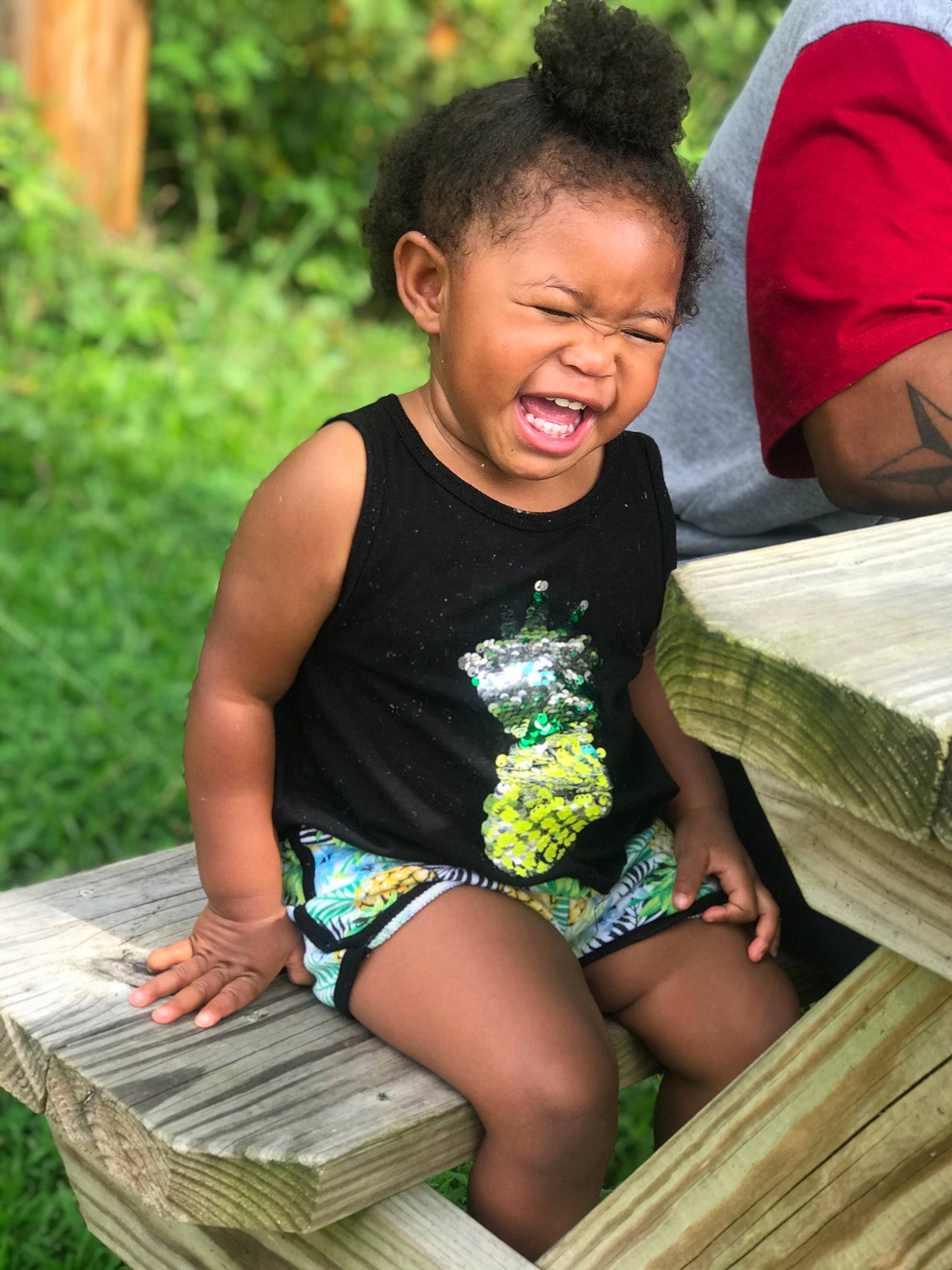 Ahzaria is registered to the contest to win money with this photo: adaptation, child, fun, grass, person, sitting, smile, vacation