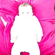 Lilou participe au concours pour gagner de l'argent avec cette photo : baby, infant, child, pillow, bedding, overexposed, white_clothing, magenta_pillow, pink, couch, sofa, indoor, lying_down, portrait, head, face, hands, soft_texture, brightness, cozy