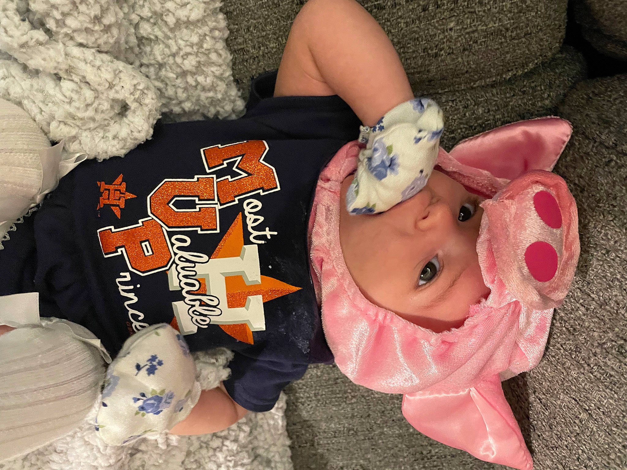 Ava is registered to the contest to win money with this photo: baby, baby_products, baby_toddler_clothing, child, comfort, doll, fashion_accessory, fun, hat, headgear, headwear, mammal, mouth, nail, pattern, person, stuffed_toy, sweetness, textile, toddler
