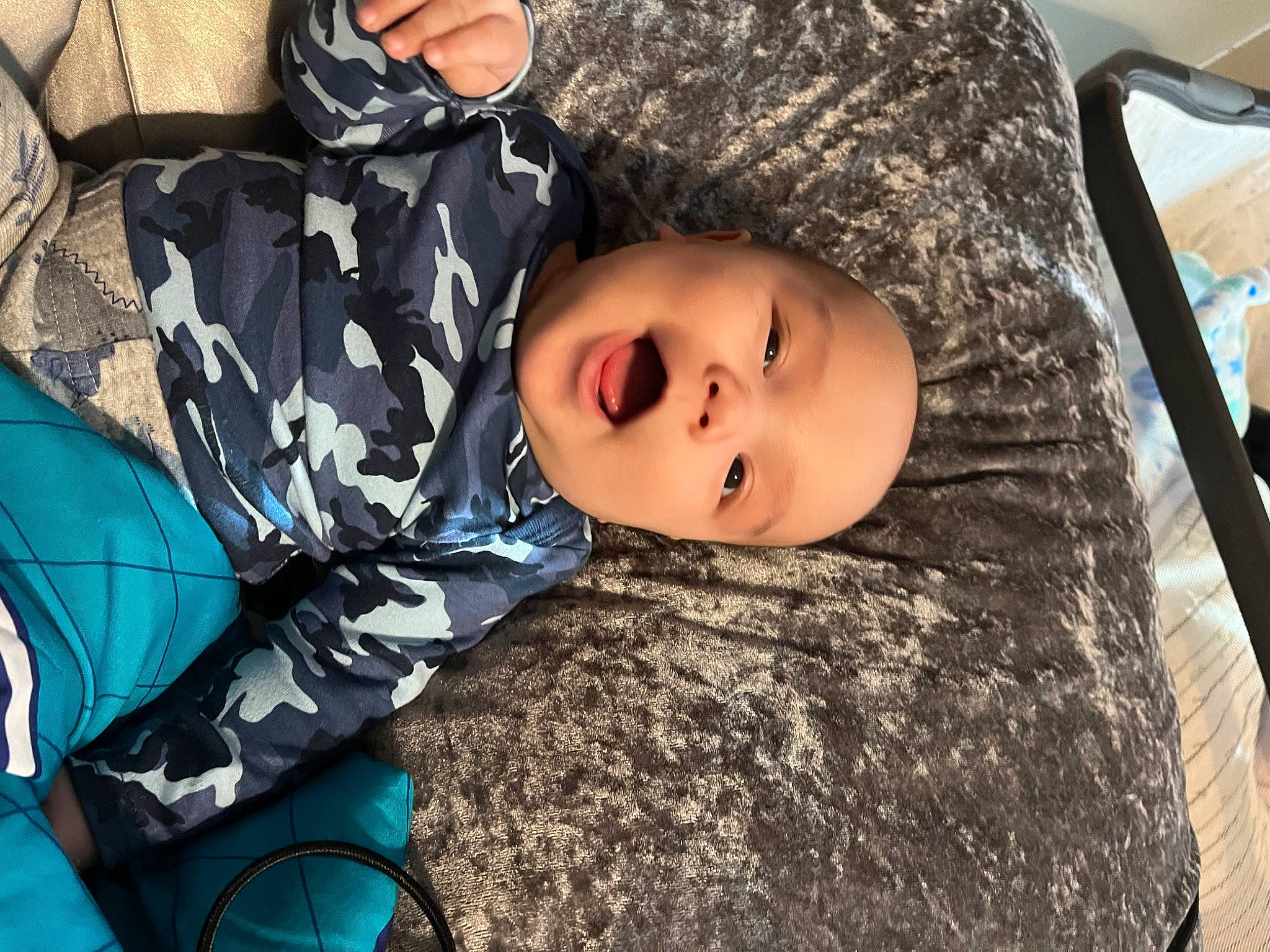 Khalani is registered to the contest to win money with this photo: child, comfort, fun, fur, grass, happy, headwear, leisure, pattern, person, plant, portrait_photography, sitting, toddler, tree, winter, wood