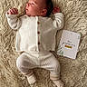Noah participe au concours pour gagner de l'argent avec cette photo : baby, button_details, cozy, cute, face, fur_rug, home_interior, infant, knit_sweater, lying_down, milestone_card, neutral_tones, newborn, portrait, ribbed_pants, sleepy, small_hands, socks, soft_texture, white_clothing