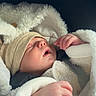 baby, beanie, blanket, car_seat, closeup, cozy, faux_fur, hand, hat, hood, indoor, infant, newborn, pale_skin, peaceful, portrait, seatbelt, sleeping_baby, soft_texture, warm_clothing