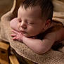 baby, newborn, sleeping, face, head, hair, eyelashes, hands, arm, blanket, burlap, basket, wooden_blocks, wood, props, portrait, closeup, soft_texture, cozy, studio_photography