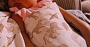 Naomi is registered to the contest to win money with this photo: baby, newborn, sleeping, blanket, animal_prints, arm, cozy, indoors, soft_light, couch, fabric, child, peaceful, wrapped, resting, person, skin, infant, warm, comfort