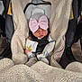 Berkeley is registered to the contest to win money with this photo: baby, newborn, sleeping, car_seat, blanket, hat, bow, cozy, infant, clothing, child, bundle, cute, pink, fabric, seatbelt, indoor, soft, headwear, resting