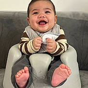 Kent Michael joined the competition — help win amazing prizes! baby, smiling, infant, baby_seat, bib, striped_sweater, happy, cute, hands, feet, indoor, portrait, child, seated, rosy_cheeks, young_child, clothing, face, person, comfort