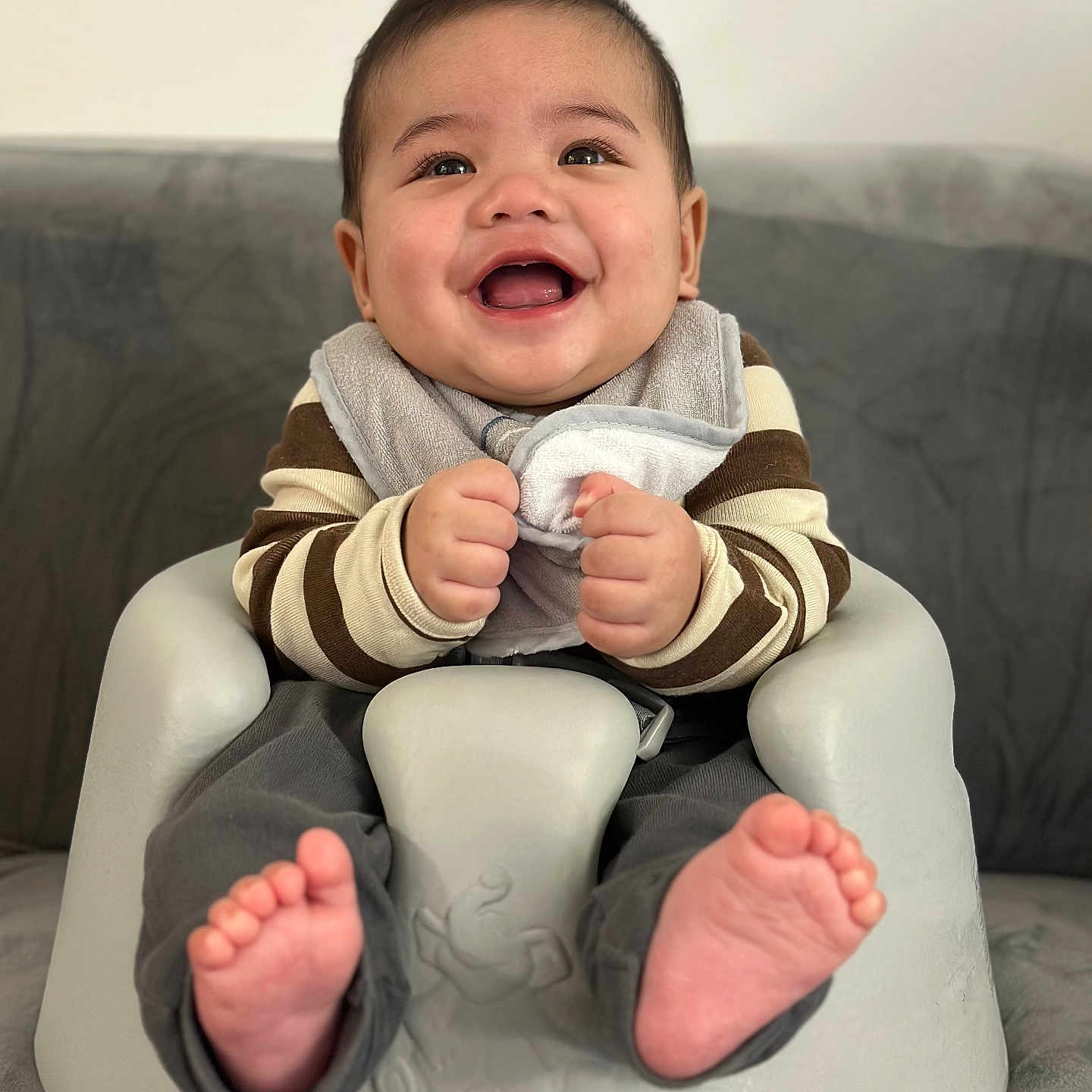 Kent Michael joined the competition — help win amazing prizes! baby, baby_seat, bib, child, clothing, comfort, cute, face, feet, hands, happy, indoor, infant, person, portrait, rosy_cheeks, seated, smiling, striped_sweater, young_child
