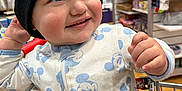 Santino joined the competition — help win amazing prizes! toddler, child, baby, shopping_cart, beanie, hat, clothing, mickey_mouse, onesie, store, indoor, shelf, products, smiling, happy, face, hand, seatbelt, retail, shopping