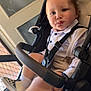 Santino joined the competition — help win amazing prizes! toddler, child, stroller, face, pout, white_shirt, suspenders, checkered_shoes, socks, indoor, door, mesh_screen, seat_belt, baby, legs, footwear, person, cute, expression, casual