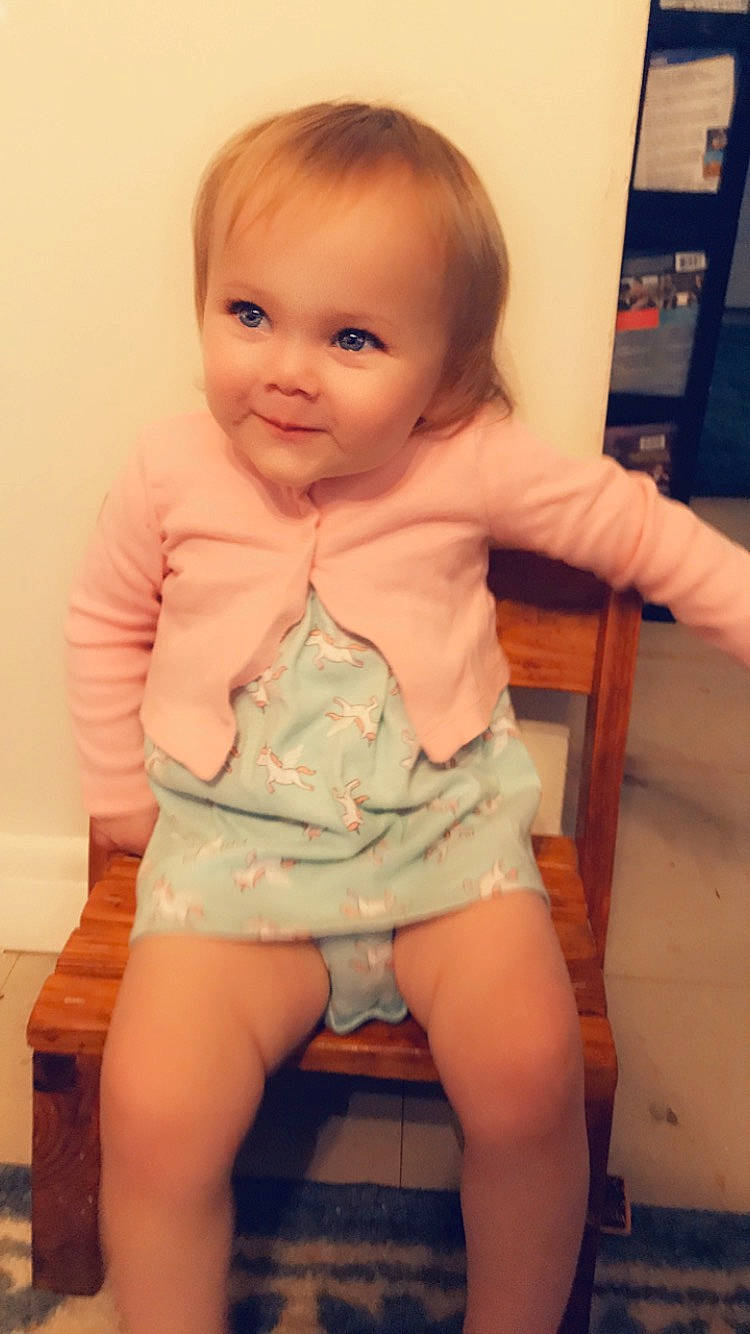 Gracelynn is registered to the contest to win money with this photo: baby_toddler_clothing, cheek, chest, eyelash, face, hair, human_body, iris, joy, knee, leg, lip, mouth, neck, person, pink, skin, sleeve, smile, thigh