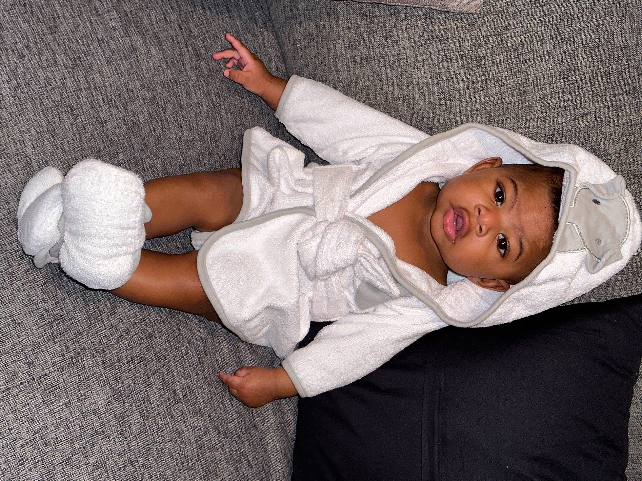 Marcus Jr. joined the competition — help win amazing prizes! arm, baby, baby_toddler_clothing, child, comfort, elbow, flash_photography, foot, gesture, hat, human_body, human_leg, knee, leg, linens, person, sitting, sleeve, sock, thigh