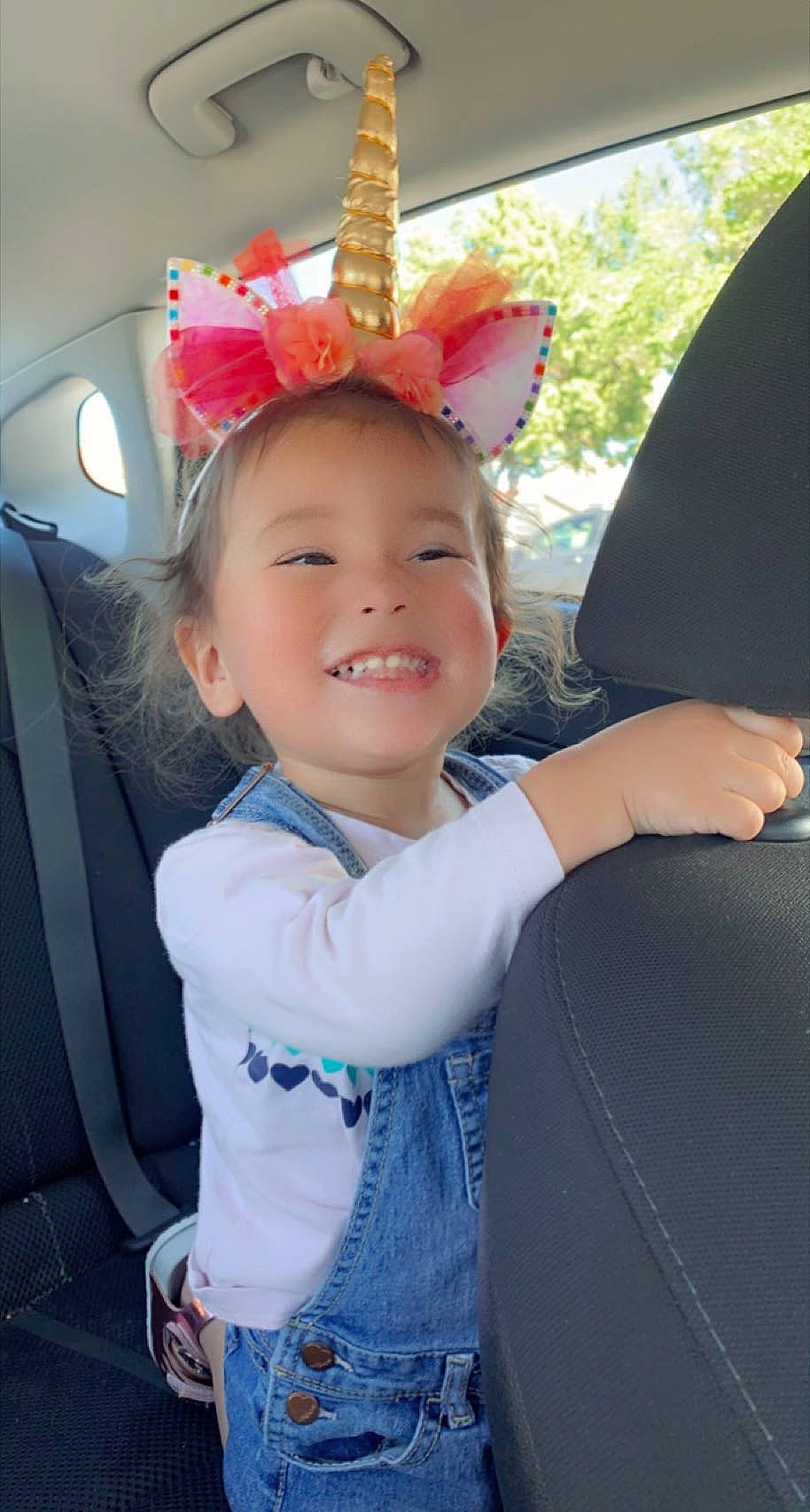 Jennifer is registered to the contest to win money with this photo: auto_part, baby, cap, car_seat, child, costume_hat, electric_blue, face, family_car, fashion_accessory, fun, gesture, happy, joy, leisure, luxury_vehicle, person, recreation, smile, toddler