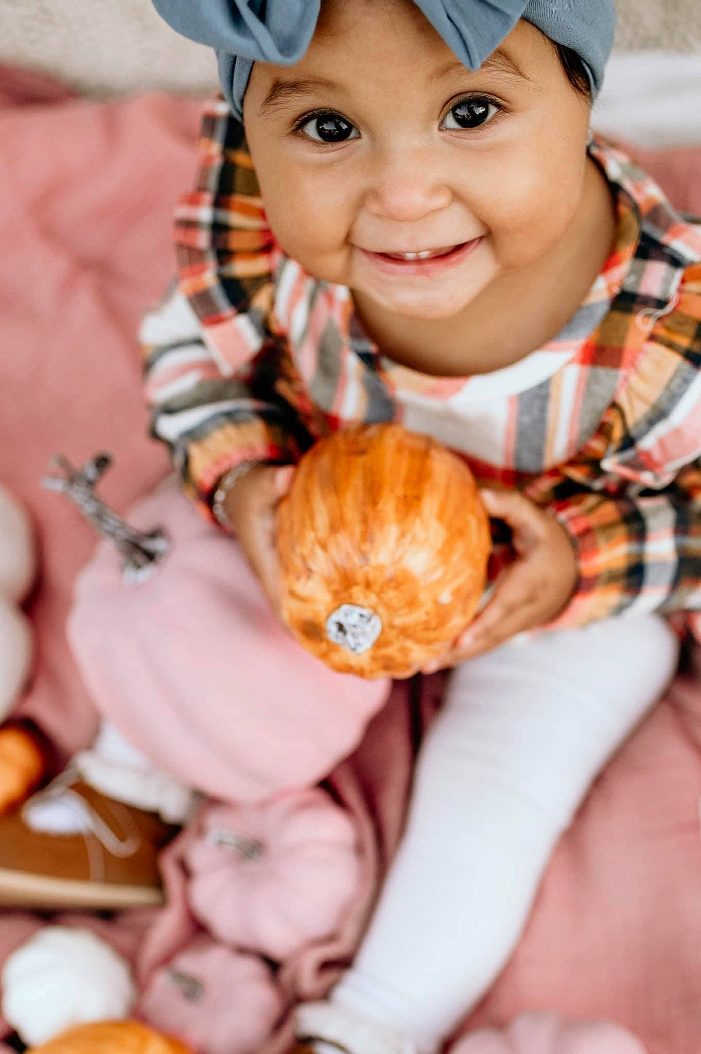 Addilyn is registered to the contest to win money with this photo: baby, baby_toddler_clothing, blue, child, dress, event, eye, finger, hand, happy, headwear, human, jewellery, joy, orange, people, person, pink, rose, skin