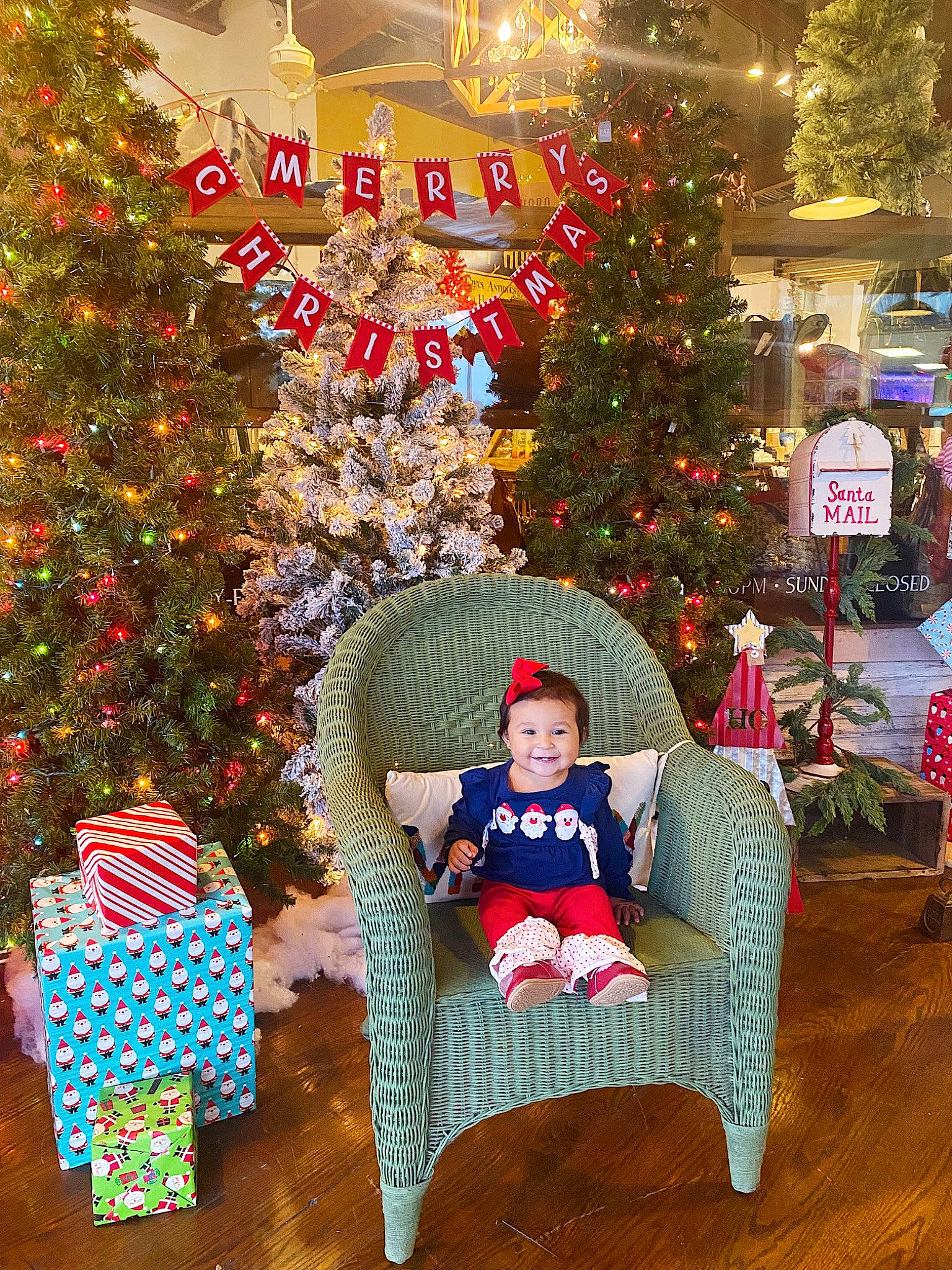 Addilyn is registered to the contest to win money with this photo: christmas, christmas_decoration, christmas_eve, christmas_ornament, christmas_tree, comfort, conifer, decoration, event, holiday, holiday_ornament, interior_design, joy, lap, lighting, ornament, person, plant, sitting, tradition