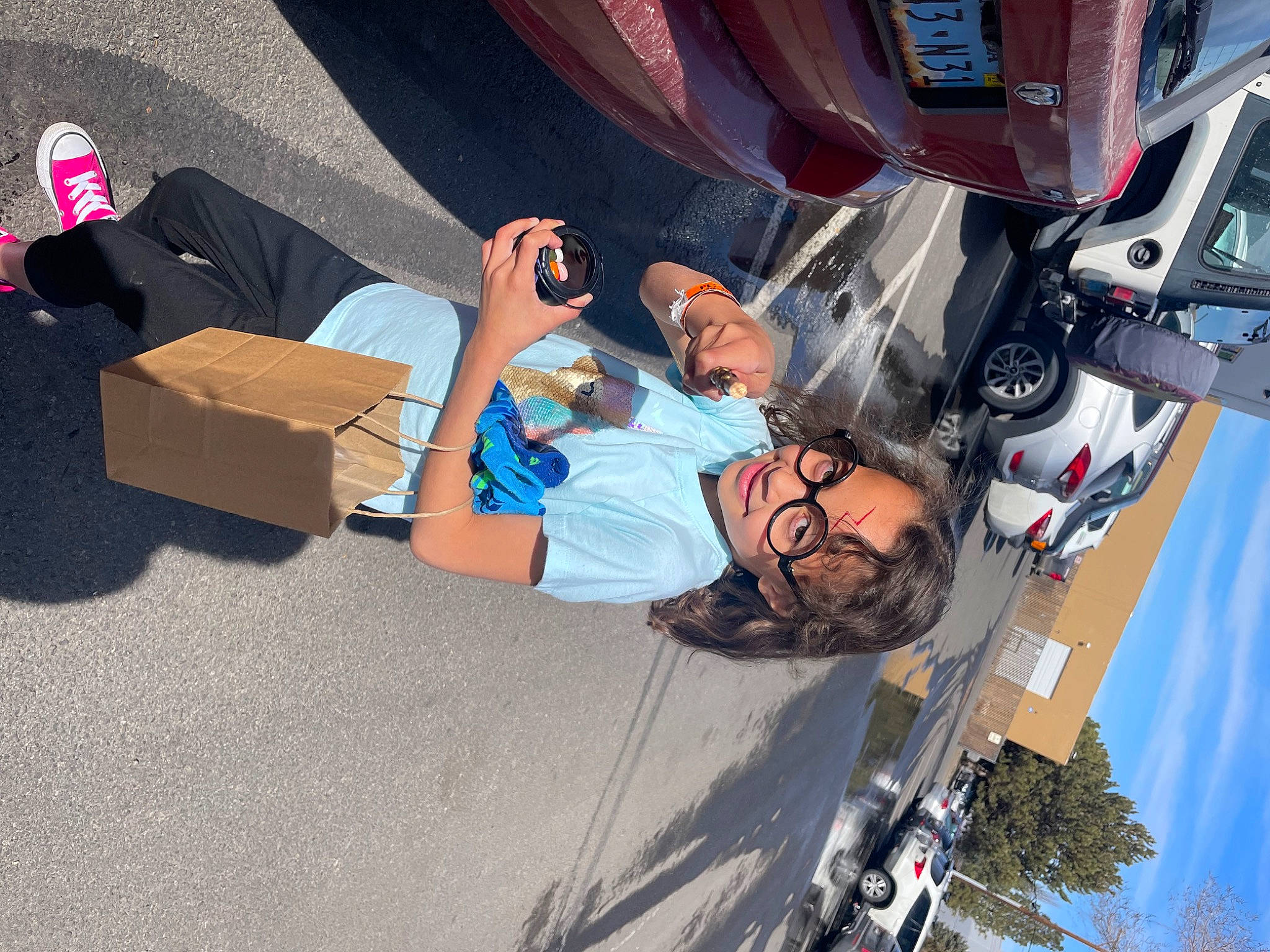 Cailee joined the competition — help win amazing prizes! automotive_design, automotive_exterior, automotive_tire, box, bumper, car, carton, fun, leisure, mode_of_transport, motor_vehicle, person, recreation, shipping_box, shorts, space, tire, trunk, vehicle, vehicle_door