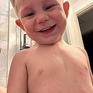 James joined the competition — help win amazing prizes! child, toddler, smiling, wet_skin, bathroom, door, indoor, face, head, skin, expression, happy, teeth, short_hair, bare_chest, plumbing, light, wall, person, closeup
