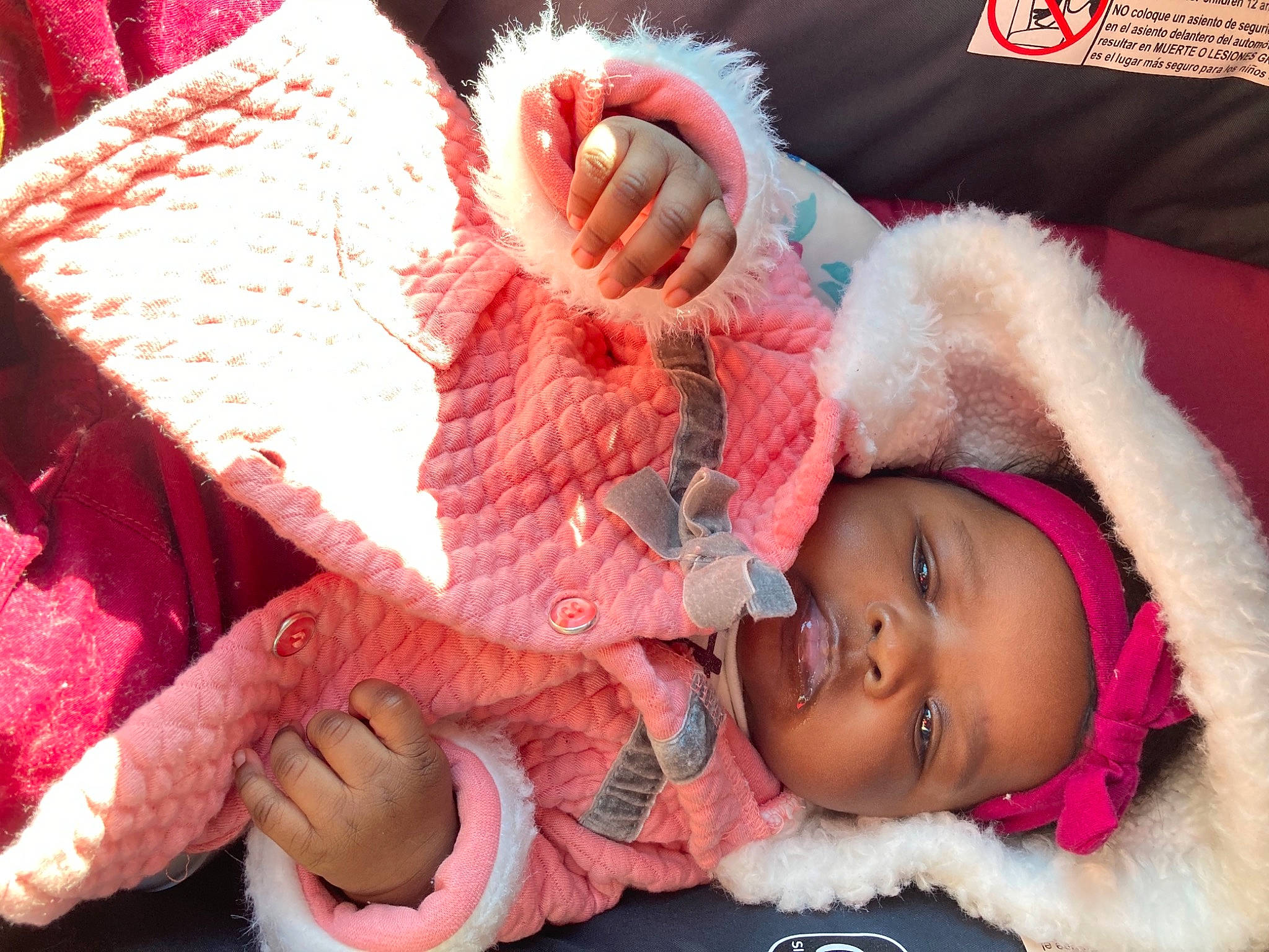 Bougie joined the competition — help win amazing prizes! baby, baby_toddler_clothing, cap, cheek, child, eye, eyelash, facial_expression, happy, head, headgear, headwear, human_body, knit_cap, nose, organ, person, pink, red, skin