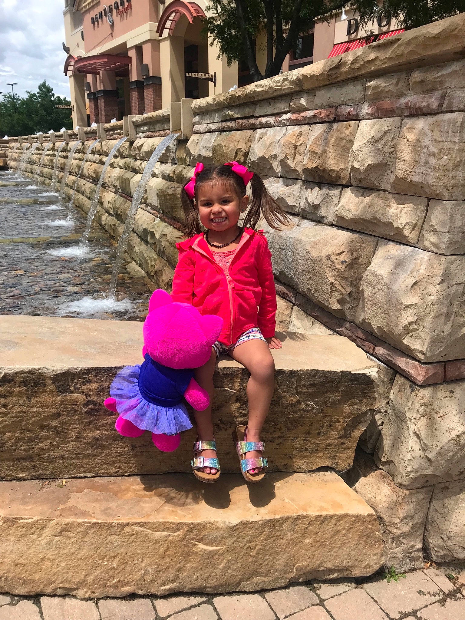 Daya is registered to the contest to win money with this photo: adaptation, architecture, child, fun, joy, landscape, leisure, people, person, pink, play, recreation, rock, smile, temple, toddler, tourism, travel, tree, vacation