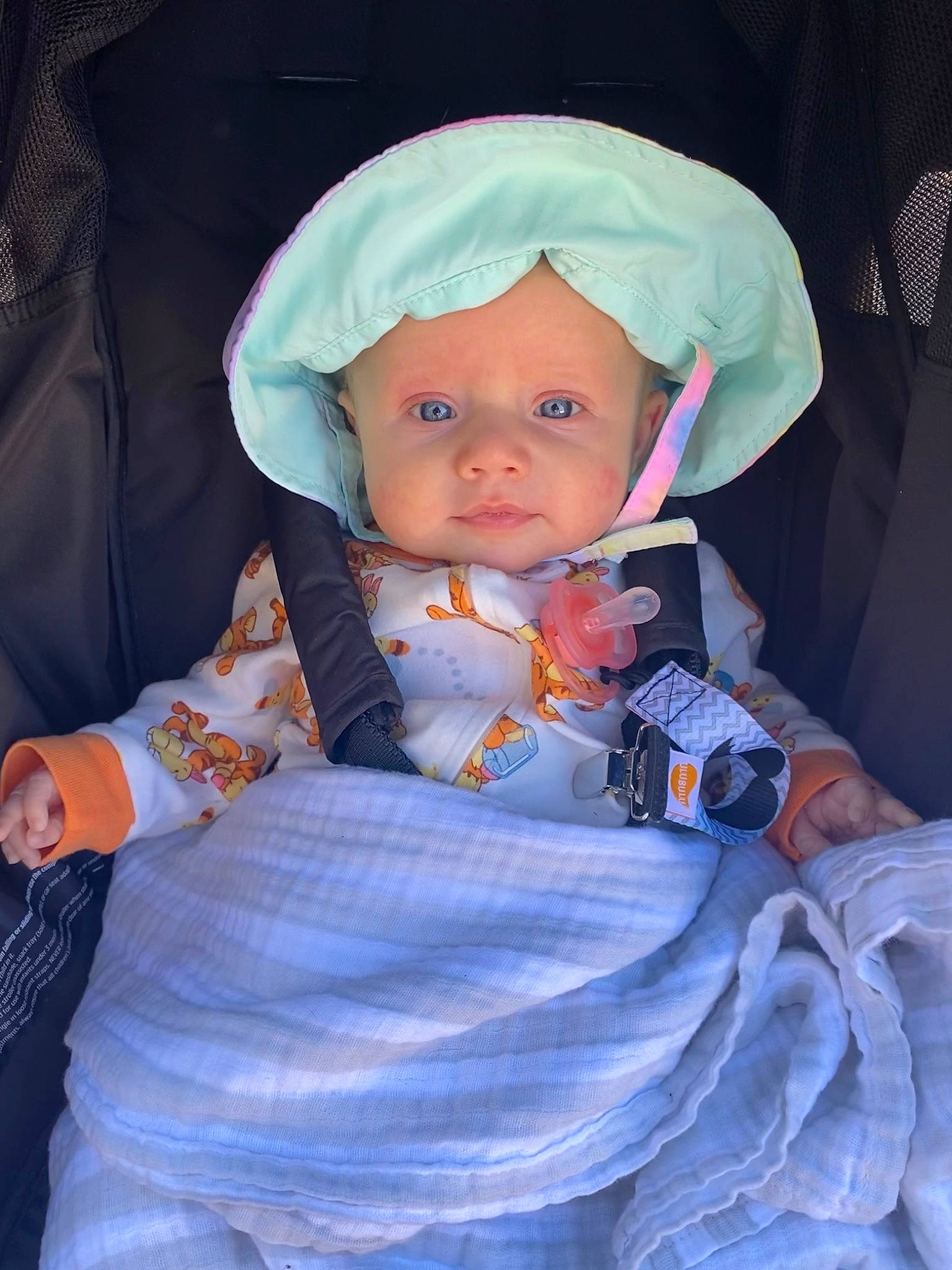Aurora is registered to the contest to win money with this photo: baby, baby_carriage, baby_products, baby_toddler_clothing, beauty, car_seat, cheek, child, comfort, electric_blue, fashion_accessory, fun, headwear, iris, outerwear, person, product, purple, sitting, textile