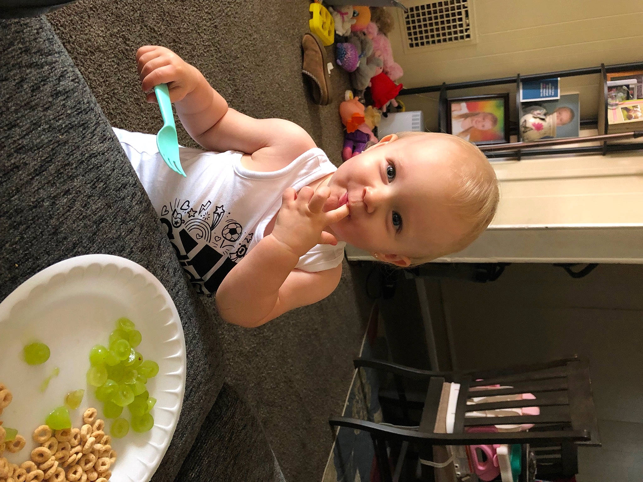 Emmie is registered to the contest to win money with this photo: baby, child, comfort_food, cooking, dishware, food, fun, happy, ingredient, person, picture_frame, plate, platter, recipe, room, shelf, smile, table, tableware, television