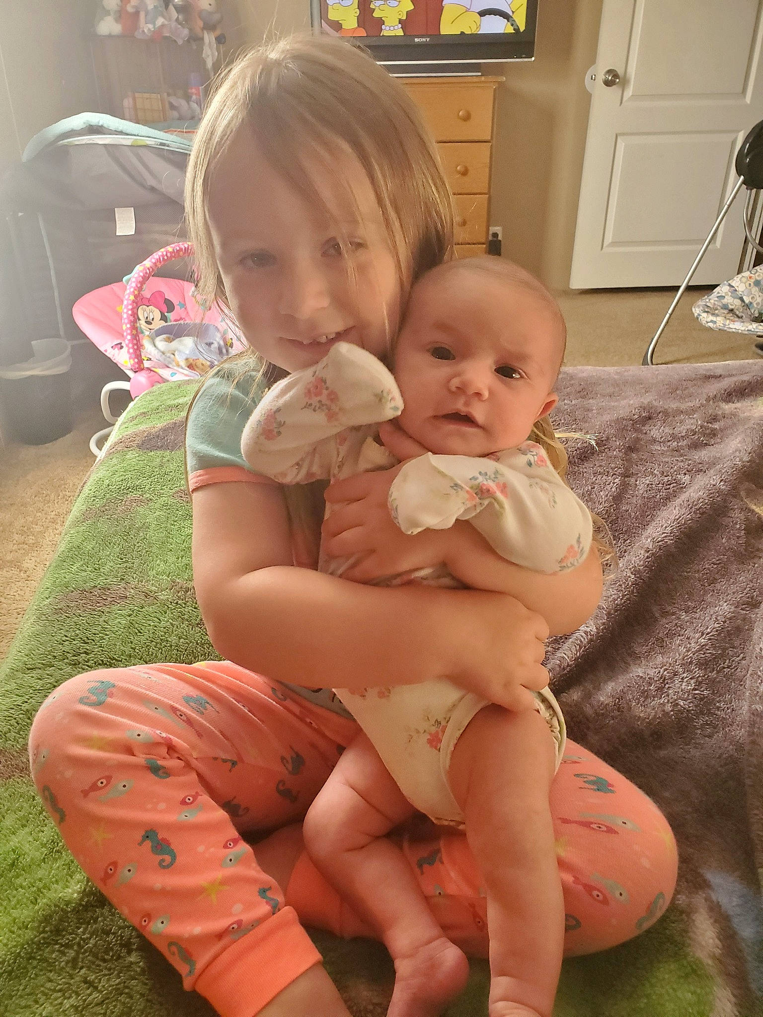 Eleanor Grace is registered to the contest to win money with this photo: abdomen, baby, cheek, child, finger, lap, leg, person, sibling, sitting, skin, smile, toddler