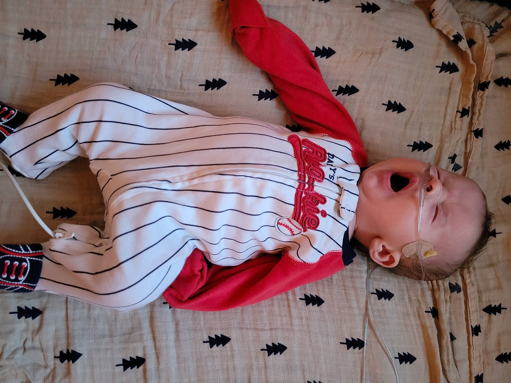 Koda is registered to the contest to win money with this photo: baby, baby_products, baby_toddler_clothing, button, carmine, child, collar, dress_shirt, fashion_accessory, linens, pattern, peach, person, pink, plaid, room, sleeve, textile, toddler, white