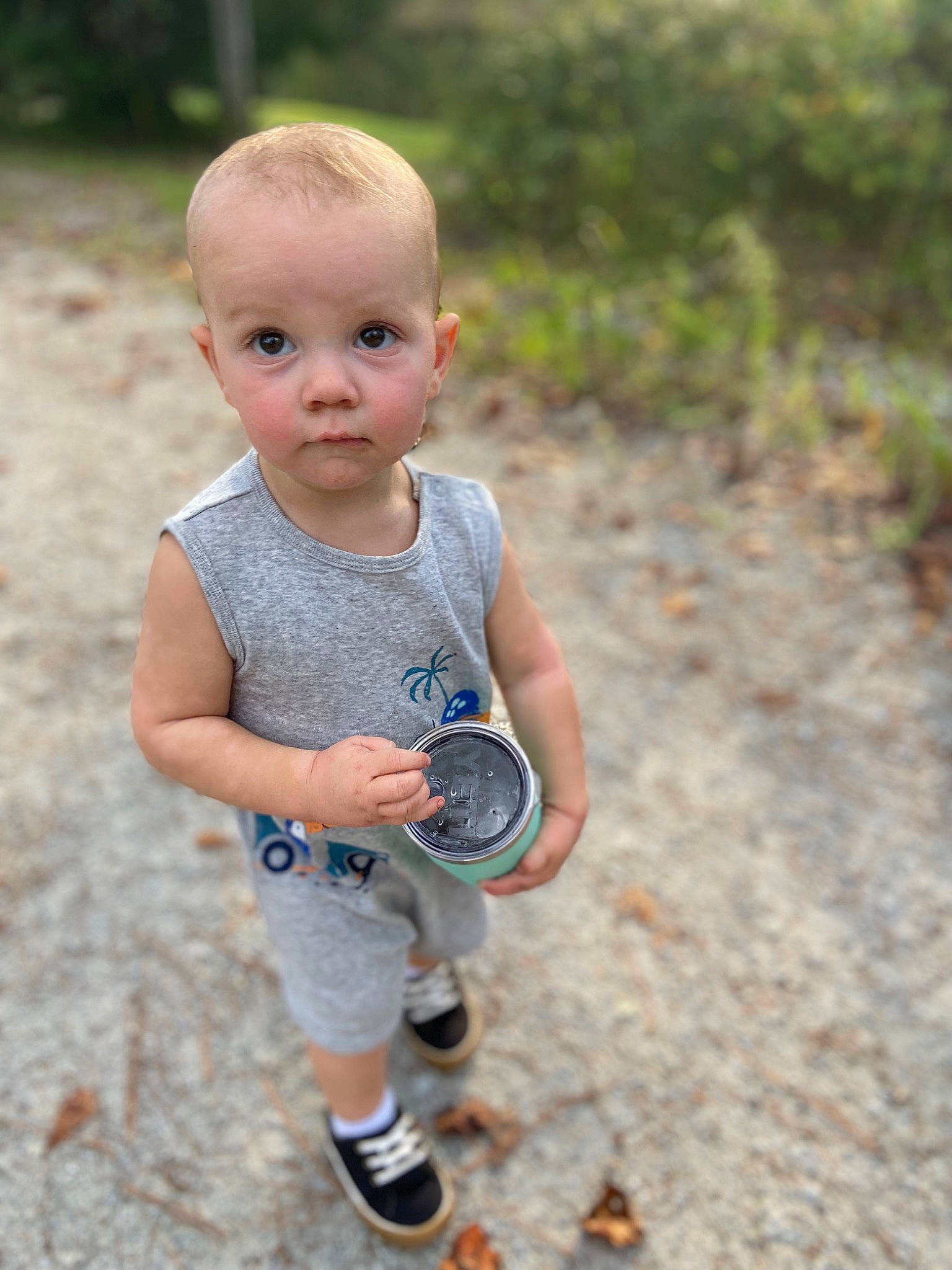 Christopher Jr is registered to the contest to win money with this photo: baby_toddler_clothing, child, eye, fun, grass, happy, human_leg, joint, leisure, people_in_nature, person, recreation, shoe, shorts, sitting, sneakers, sock, soil, t_shirt, toddler